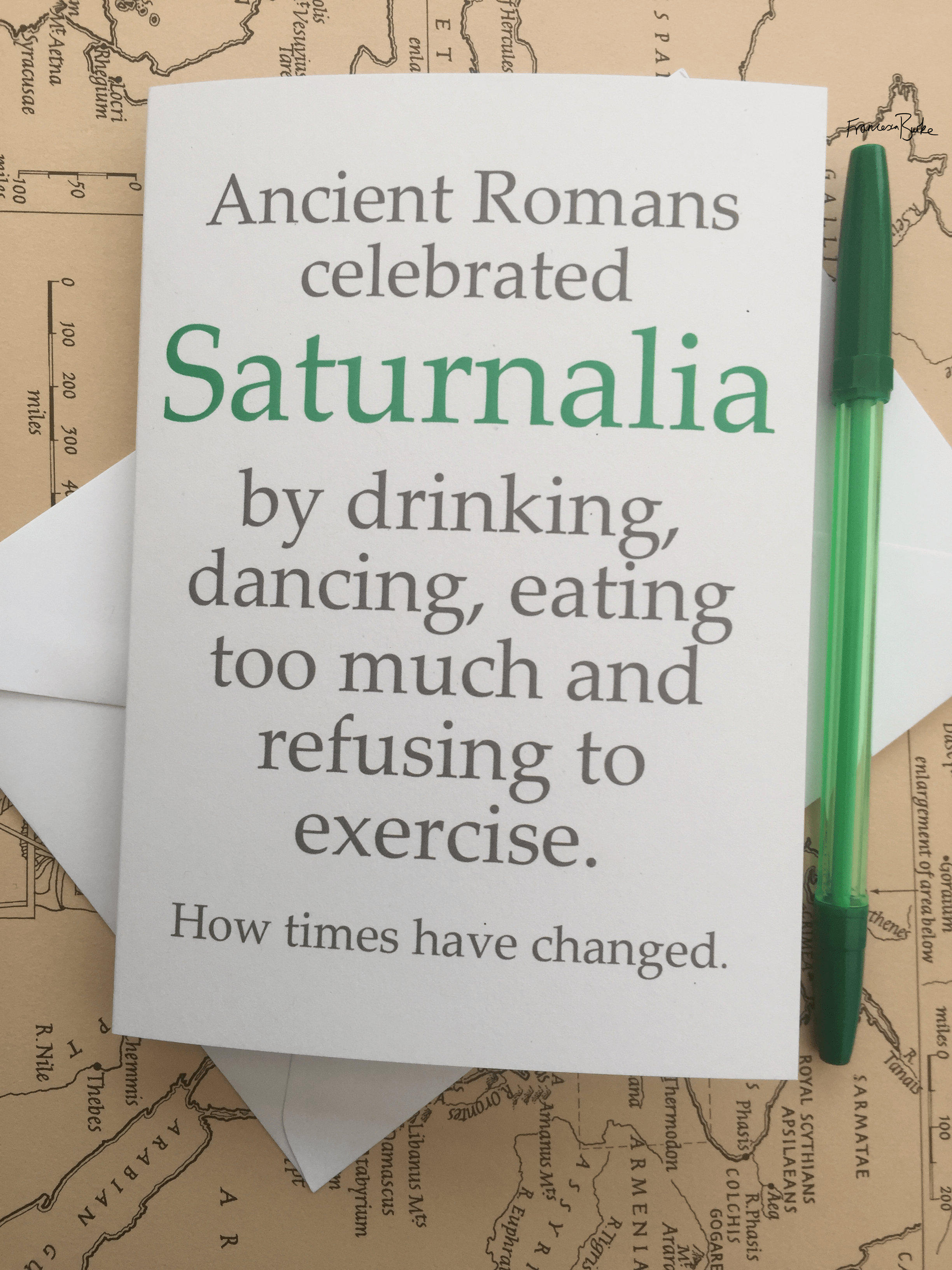 Saturnalia/Roman mythology-inspired Christmas card, green and grey on white card. Portrait design.
