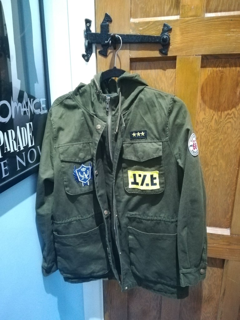 green khaki New Look jacket with MCR and Raven Cycle patches