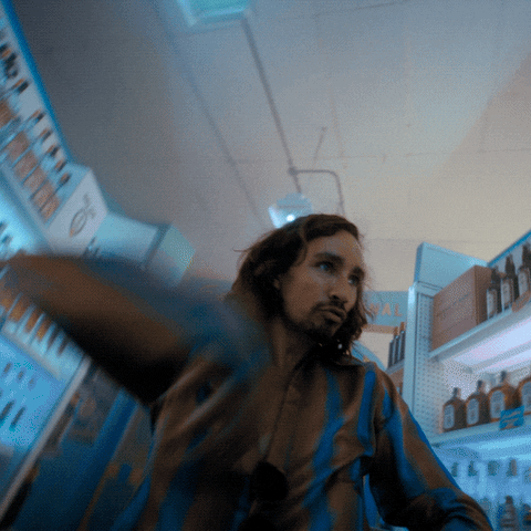 Klaus Hargreeves dancing in a liquor store