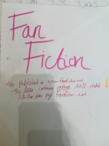 paper reading 'Fan Fiction Also published on www.fanfiction.net. This folder contains nothing MCR-related. Neither does my fanfiction.net.'