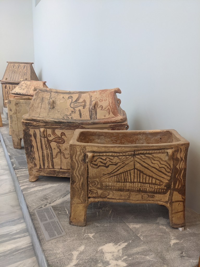 Three painted larnakes in the Heraklion Archaeological Museum, Crete.